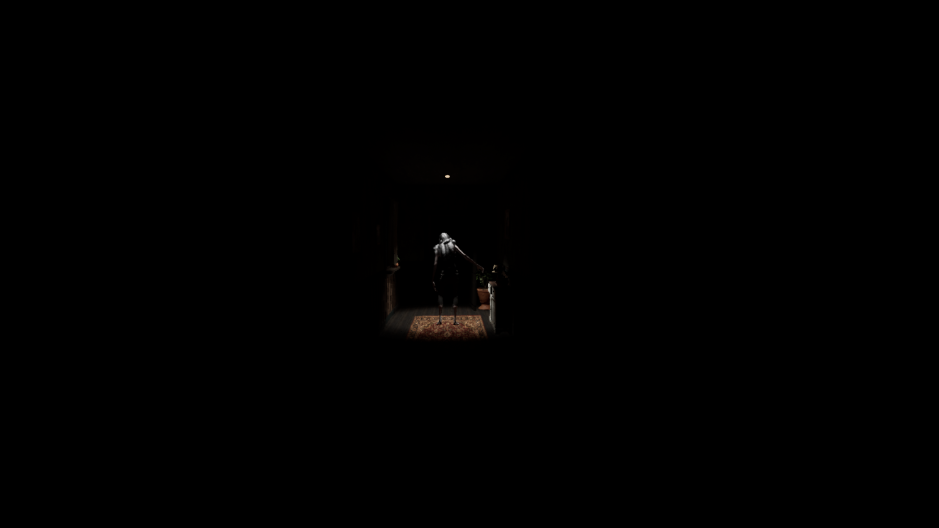 A threatening figure stands beneath a ceiling light at the far end of a dark hallway